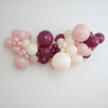 DIY balloon garland kit in our Joiène Original colours featuring a mix of blush pink, muted sand and wild berry coloured latex balloons styled in a professional organic garland.