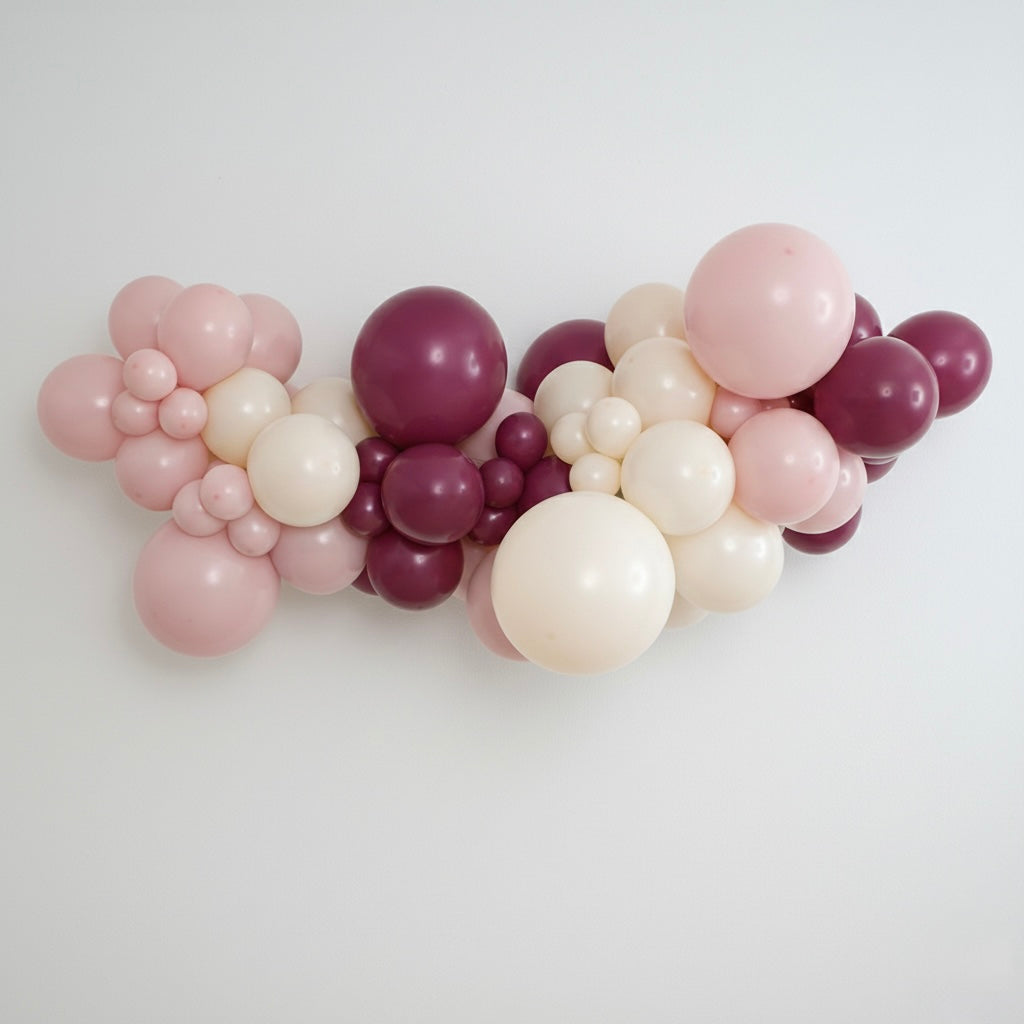 DIY balloon garland kit in our Joiène Original colours featuring a mix of blush pink, muted sand and wild berry coloured latex balloons styled in a professional organic garland.