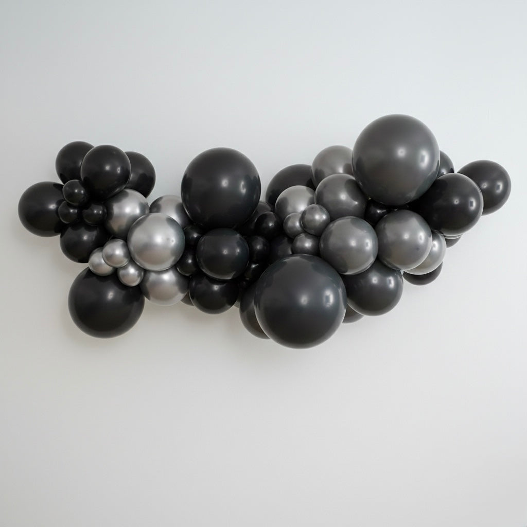 DIY balloon garland kit in black, grey and silver, professional grade, latex balloons. Styled in a professional organic garland.