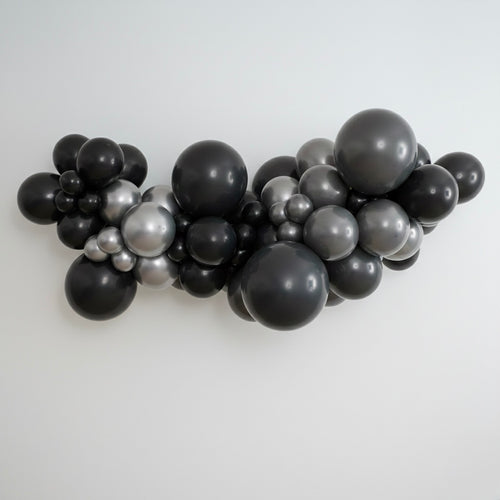 DIY balloon garland kit in black, grey and silver, professional grade, latex balloons. Styled in a professional organic garland.